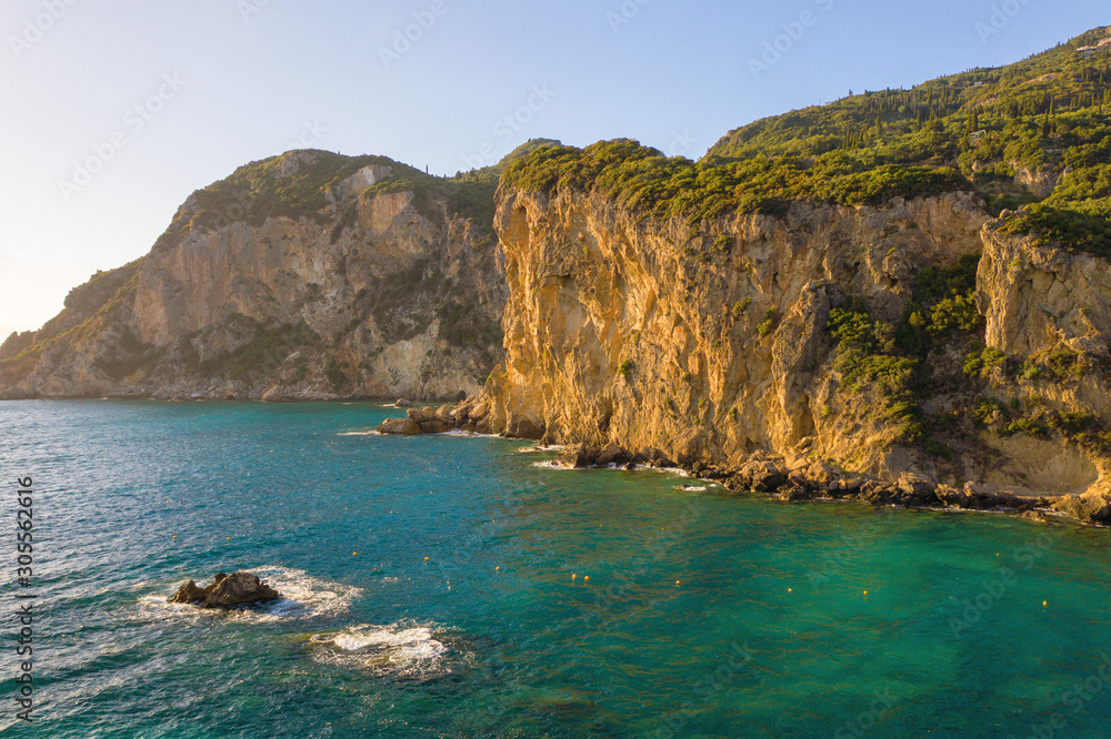 Fototapeta premium Beautiful cliffs near sea or ocean during sunset