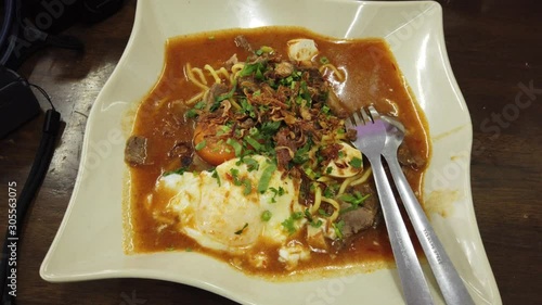 Mee Bandung Muar: Special dish noodle originated from Muar District, Johore, Malaysia. The Noodle is prepared with special paste with fresh prawn and vegetables, selective focus photo