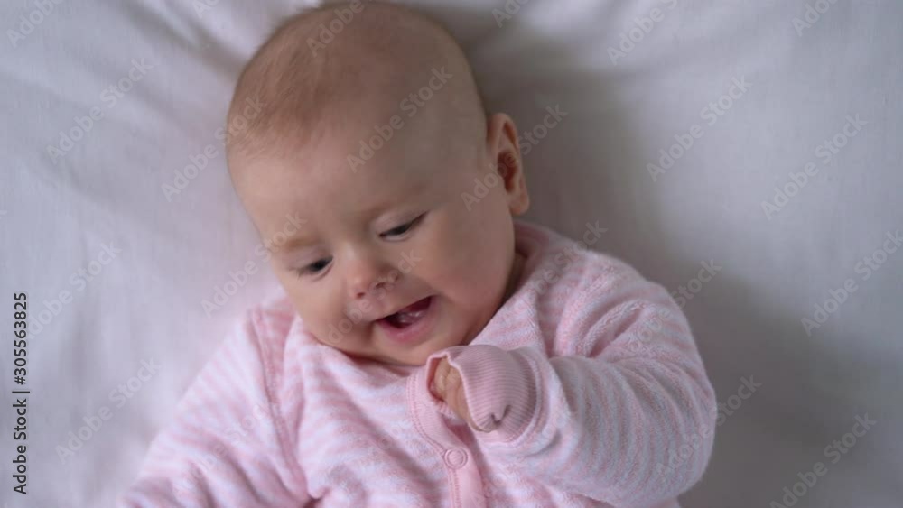Funny baby chewing fingers to relieve pressure on gums while teething, health Funny baby chewing fingers to relieve pressure on gums while teething, health