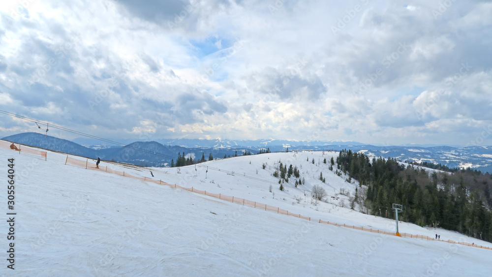 wonderful snowy mountain landscape in early spring