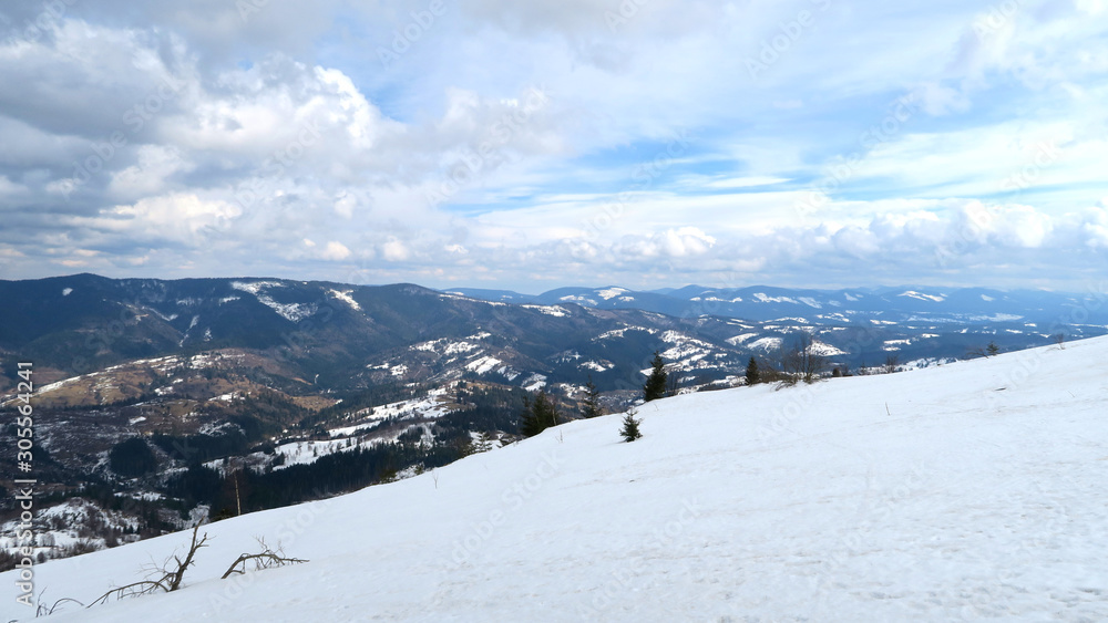 wonderful snowy mountain landscape in early spring