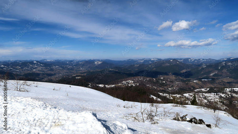 wonderful snowy mountain landscape in early spring