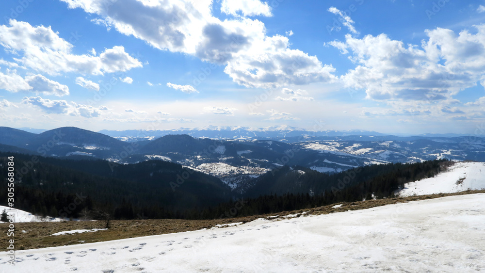 wonderful snowy mountain landscape in early spring