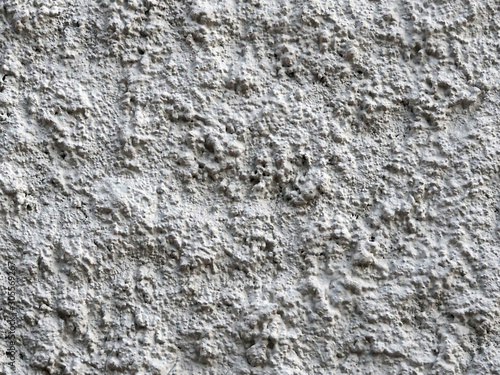 rough gray concrete wall texture with shadows