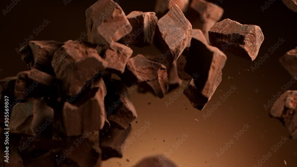 Super Slow Motion Shot of Raw Chocolate Chunks and Cocoa Powder after Being Exploded at 1000fps. Super Slow Motion Shot of Raw Chocolate Chunks and Cocoa Powder after Being Exploded at 1000fps.