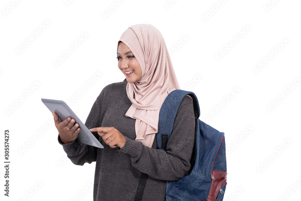 College student using tablet to study and carrying a bag at isolated background College student using tablet to study and carrying a bag at isolated background