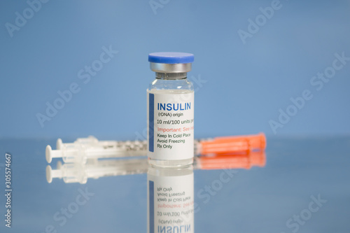Insulin And Syringes On Metal Tray