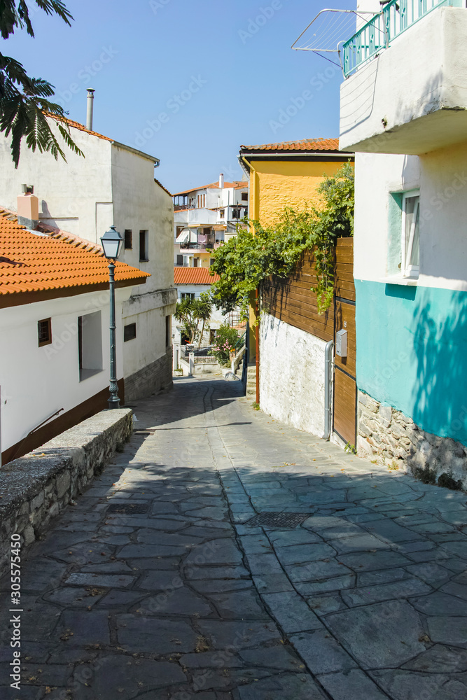 Typical street and houses at old town of city of Kavala, Greece