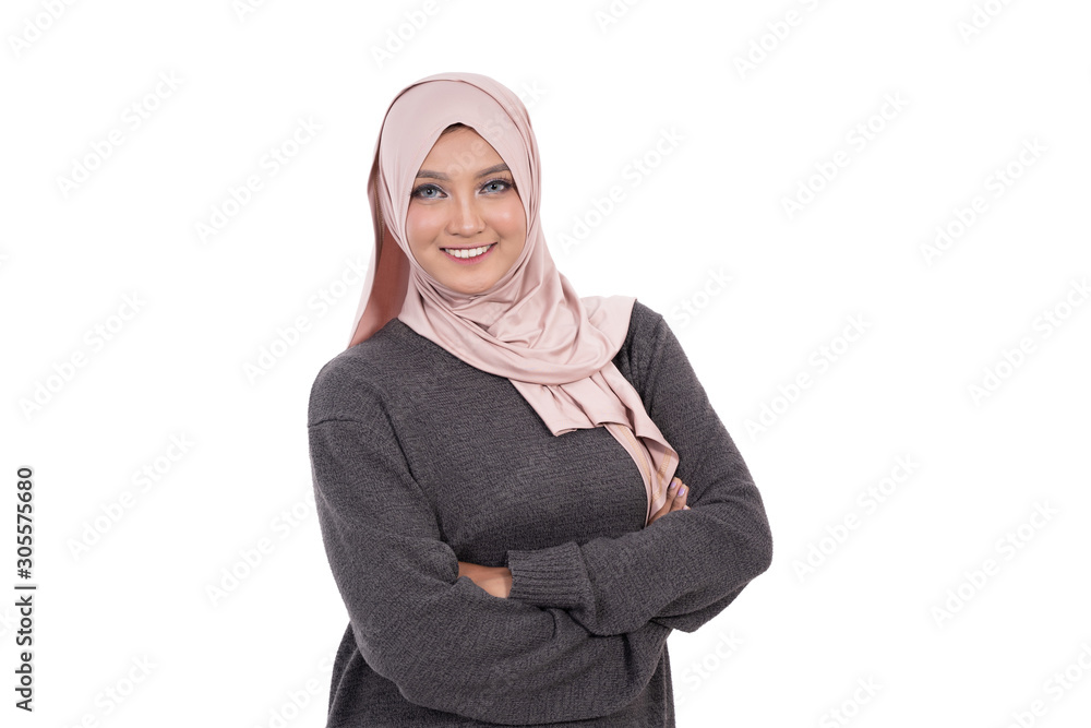Beautiful veiled woman with crossed hands and smile look at camera at isolated background Beautiful veiled woman with crossed hands and smile look at camera at isolated background