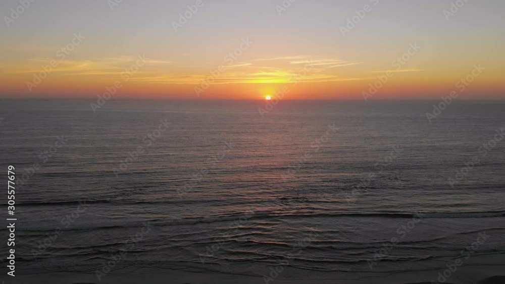 Orange Sunset Pacific Ocean (La Serena, Chile) aerial view, drone footage