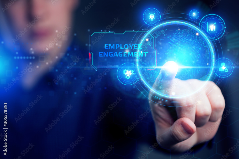 Planning marketing strategy. Business, Technology, Internet and network concept. Young businessman shows the word: Employee engagement Planning marketing strategy. Business, Technology, Internet and network concept. Young businessman shows the word: Employee engagement