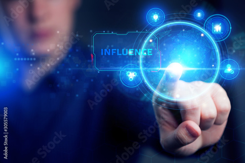 Planning marketing strategy. Business, Technology, Internet and network concept. Young businessman shows the word: Influence