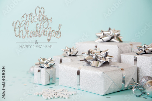 Christmas banner. Xmas silver and glitter gifts box, blue background. Horizontal poster, greeting card, headers, website. Decoration objects flat lay, top view