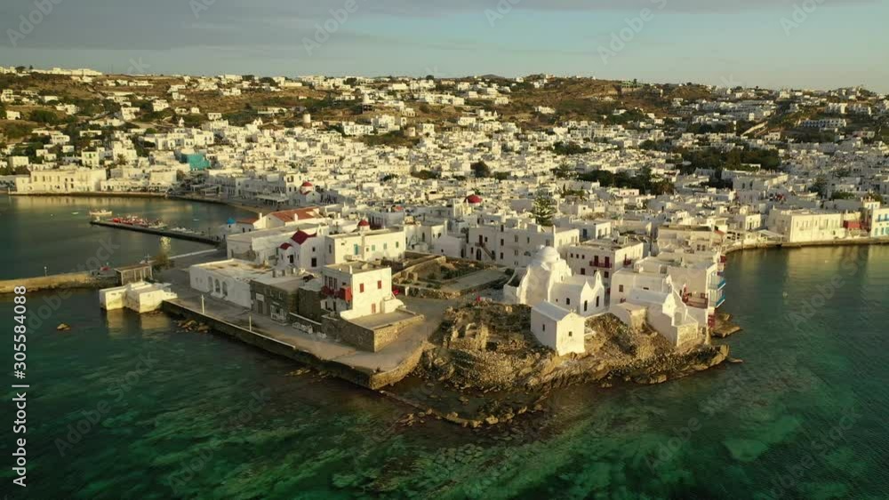 Aerial drone video of picturesque little Venice in main village of Mykonos island at sunrise with beautiful colours, Cyclades, Greece Aerial drone video of picturesque little Venice in main village of Mykonos island at sunrise with beautiful colours, Cyclades, Greece