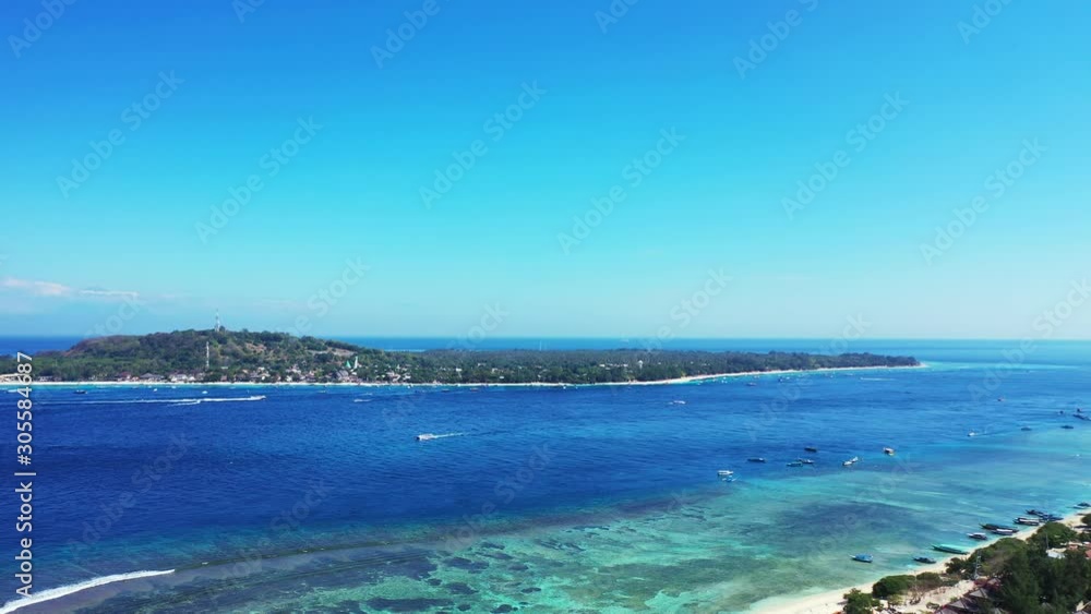 Gili trawangan Tropical Island Showing A Crystal Clear Blue Sea Water Great For Family Holiday Summer Vacation - Wide Shot Gili trawangan Tropical Island Showing A Crystal Clear Blue Sea Water Great For Family Holiday Summer Vacation - Wide Shot