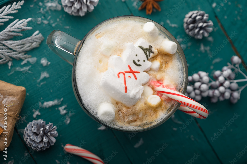 Obraz na plátně Christmas composition, mug with hot chocolate with melted snowman marshmallows and caramel