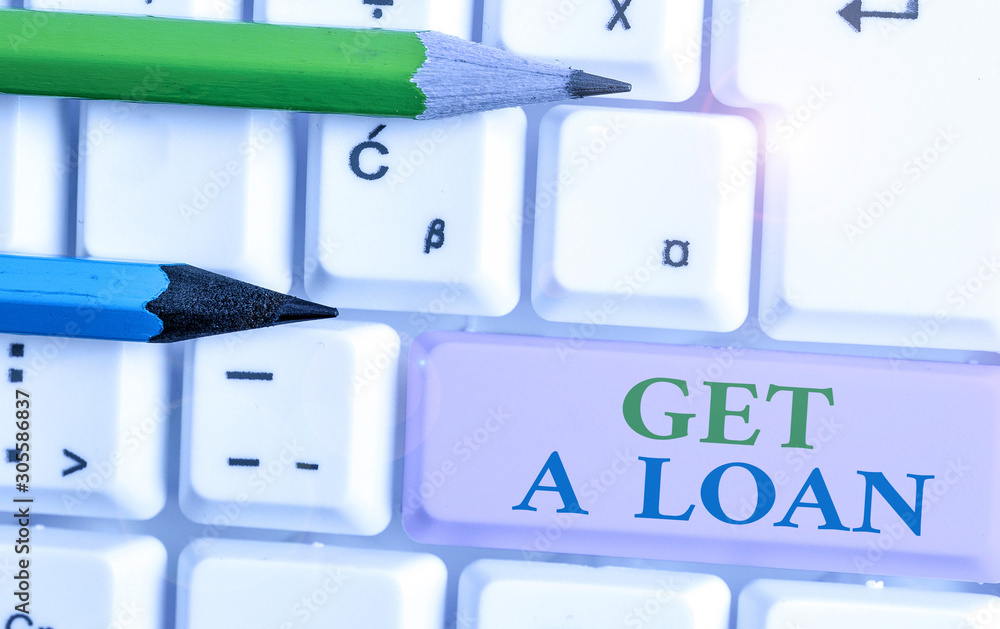 Writing note showing Get A Loan. Business concept for mount of money that is borrowed often from bank has paid back Writing note showing Get A Loan. Business concept for mount of money that is borrowed often from bank has paid back