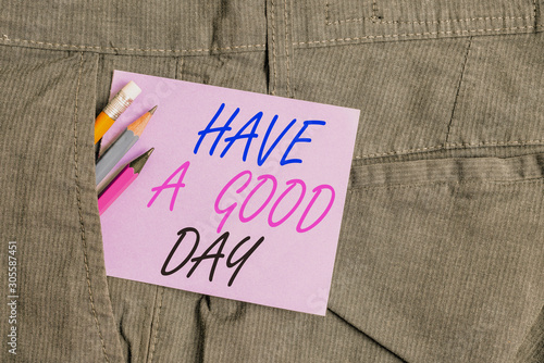 Writing note showing Have A Good Day. Business concept for Nice gesture positive wishes Greeting Enjoy Be happy Writing equipment and purple note paper inside pocket of trousers