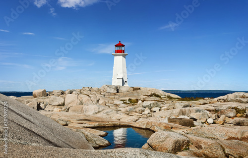 Wallpaper Mural Panorama of Nova Scotia's iconic Peggys Cove Lighthouse on a sunny day