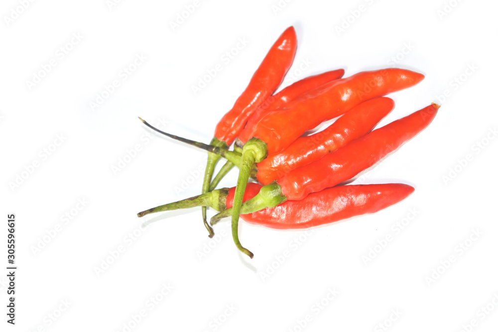 Closeup fresh red orange chili pepper with clipping path isolated on white background. Close-up red orange chilli pepper on a white background Closeup fresh red orange chili pepper with clipping path isolated on white background. Close-up red orange chilli pepper on a white background