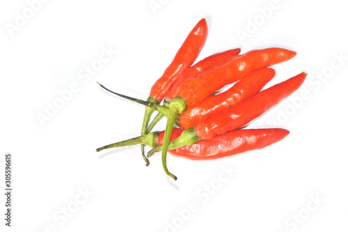 Closeup fresh red orange chili pepper with clipping path isolated on white background. Close-up red orange chilli pepper on a white background