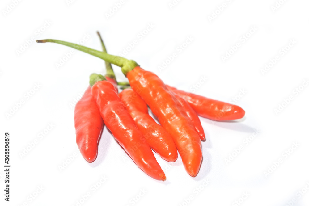 Closeup fresh red orange chili pepper isolated on a white background. Close-up red orange pepper with clipping path on white background Closeup fresh red orange chili pepper isolated on a white background. Close-up red orange pepper with clipping path on white background