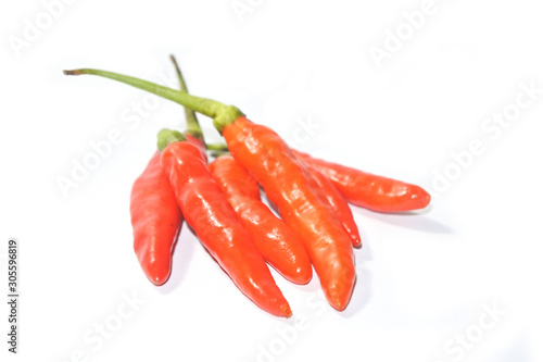 Closeup fresh red orange chili pepper isolated on a white background. Close-up red orange pepper with clipping path on white background