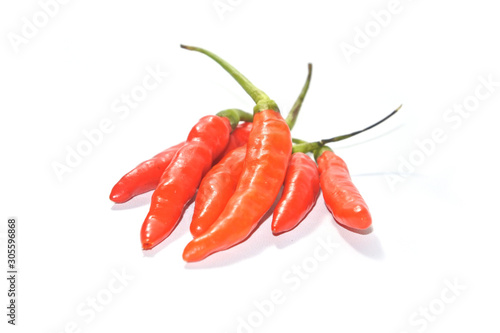 Closeup fresh red orange chili pepper on white background. Close-up red orange pepper with clipping path isolated on a white background