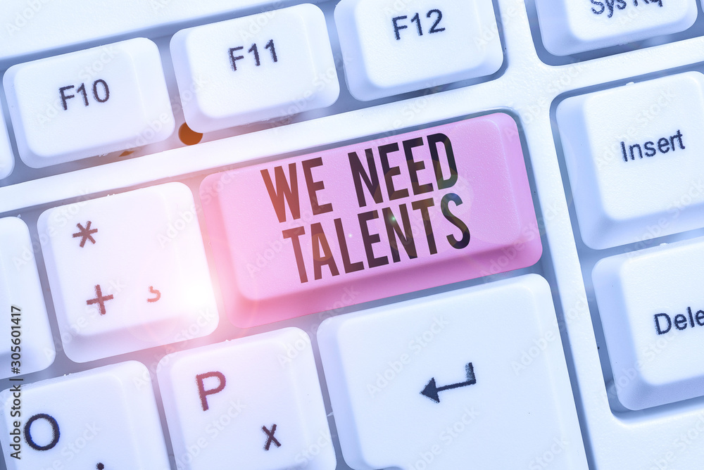 Writing note showing We Need Talents. Business concept for seeking for creative recruiters to join company or team Keyboard with note paper on white background key copy space Writing note showing We Need Talents. Business concept for seeking for creative recruiters to join company or team Keyboard with note paper on white background key copy space