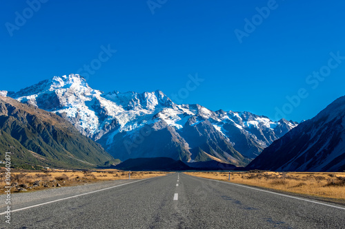 Aoraki/Mount Cook, main road to Hooker Valley track with snowy mountain of Sefton mont, against blue sky, a must Hiking Trail destination in Queenstown, New Zealand