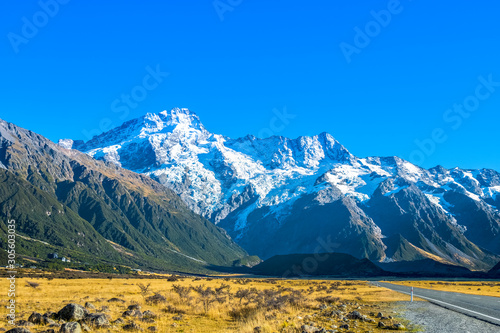 Road to Aoraki/Mount Cook, Hooker Valley track with snowy mountain of Sefton mont, against blue sky, a must Hiking Trail destination in Queenstown, New Zealand