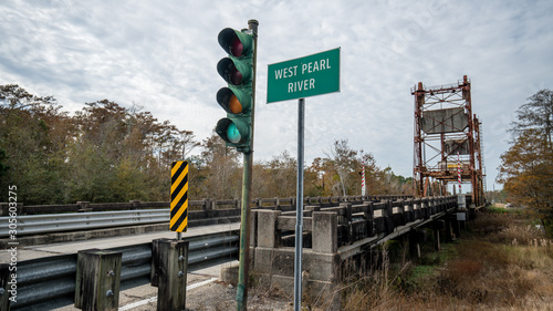 Pearl River Sign and green light on a bridge in Louisiana 