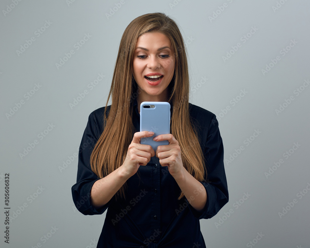 Surprising woman using smartphone isolated Surprising woman using smartphone isolated