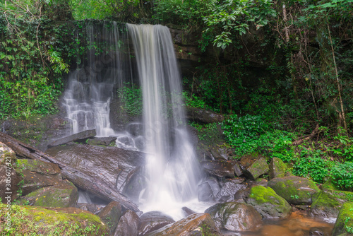 Waterfall scene at Rom Klao Pharadon Waterfalls in rainforest Thailand.
