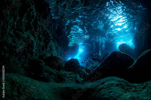 Rays of sunlight into the underwater cave