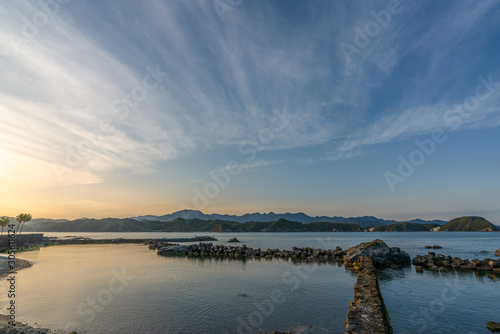 beautiful twilight sunset with blue sky high peak mountains mist fog green forest park ocean sea idea for backpacker guiding backpacking camping campfire relax hiking long weekend at Wakayama Japan