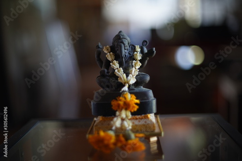 Statue of Lord Ganesa with jasmine garland