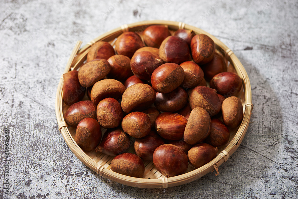 A lot of chestnuts in bamboo basket A lot of chestnuts in bamboo basket