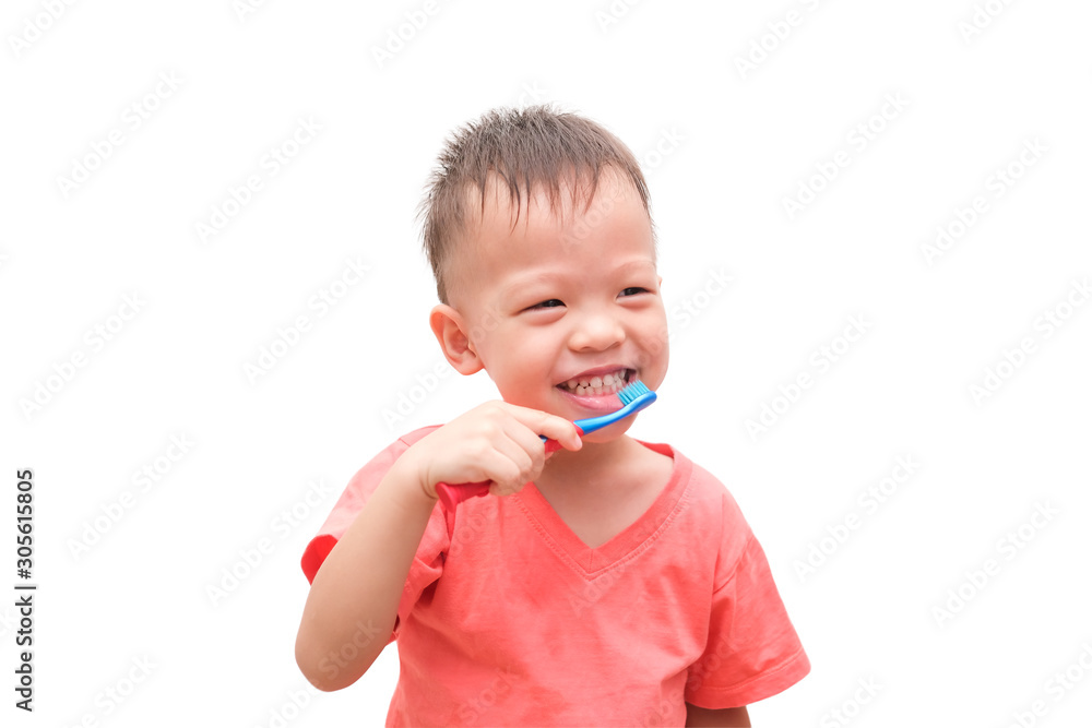 Cute smiling little Asian 3 years old toddler boy child holding toothbrush and brushing teeth isolated on white with clipping path, Tooth care for children concept Cute smiling little Asian 3 years old toddler boy child holding toothbrush and brushing teeth isolated on white with clipping path, Tooth care for children concept