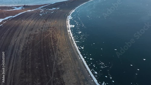 The sea coastal strip covered with ice and snow. Place of shooting northerly coast of the Bering Sea, Chukchi region, Russia.