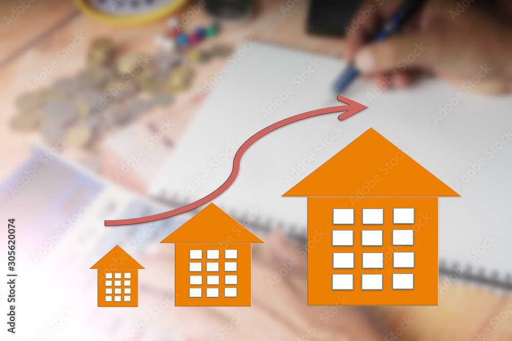 Property up trend market conceptual with up trend arrow and house icon. Blurred image background. Property up trend market conceptual with up trend arrow and house icon. Blurred image background.
