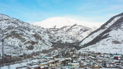 A small village located among the great mountains of Altai, filmed with a quadcopter