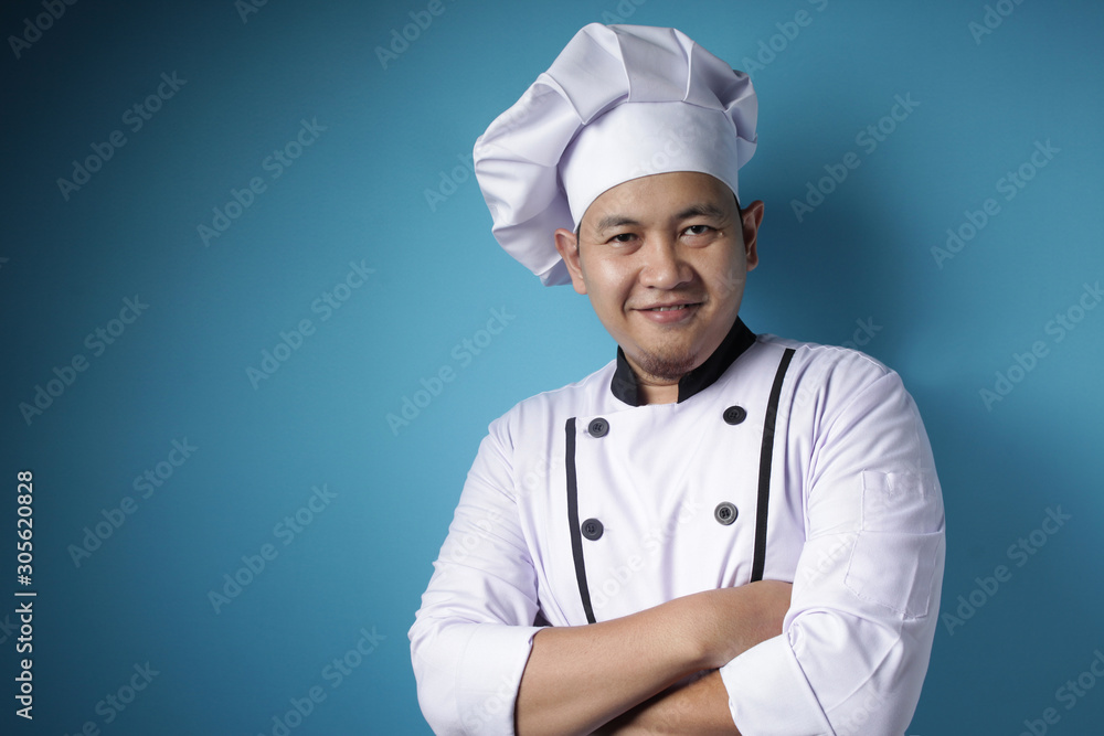Happy Proud Asian Chef Smiling at Camera With Crossed Arms Happy Proud Asian Chef Smiling at Camera With Crossed Arms