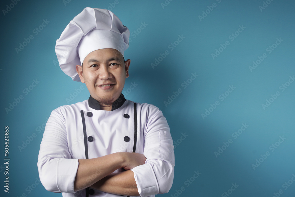 Happy Proud Asian Chef Smiling at Camera With Crossed Arms Happy Proud Asian Chef Smiling at Camera With Crossed Arms