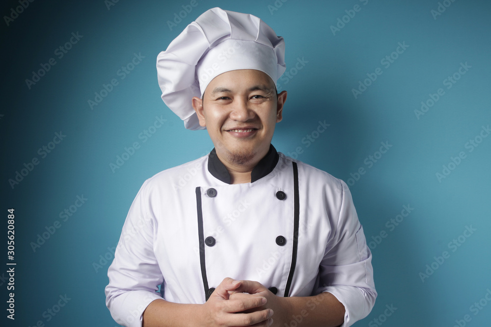 Happy Proud Asian Chef Smiling at Camera Happy Proud Asian Chef Smiling at Camera