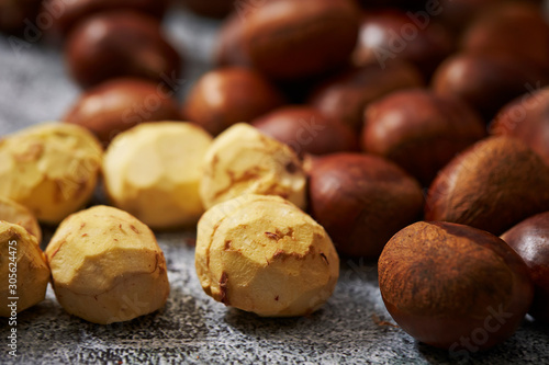 Shelled and peeled chestnuts background