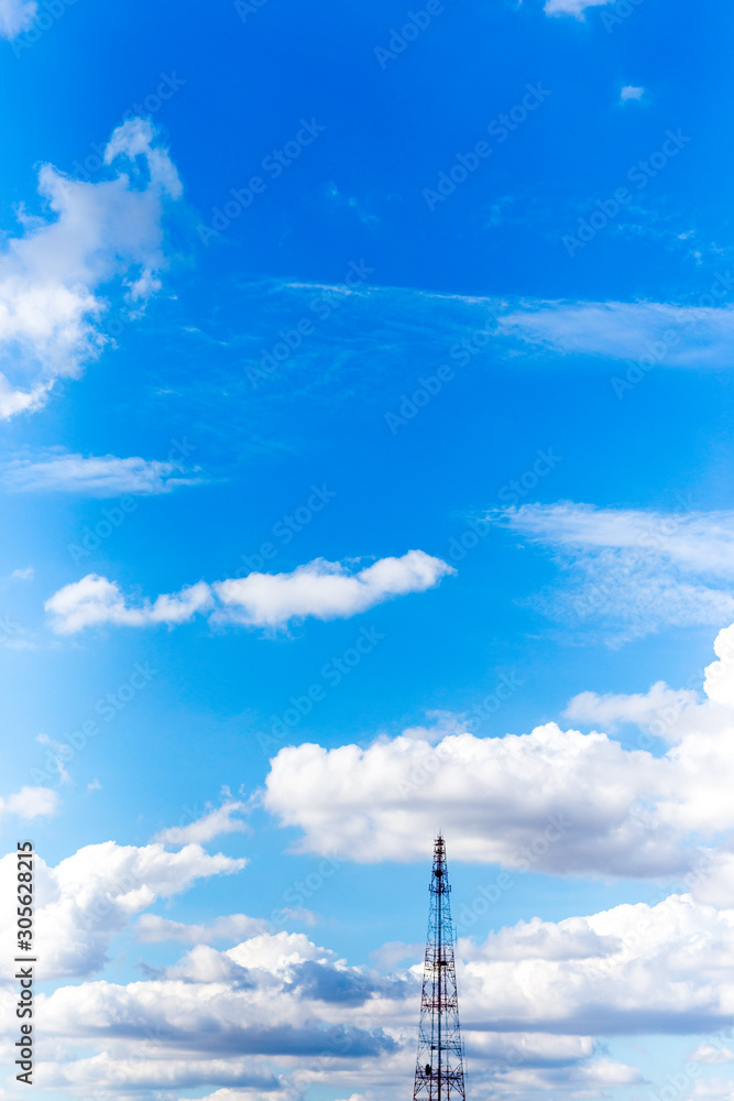Obraz premium Telephone Antennas with blue sky background.