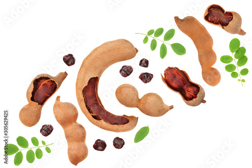 Tamarind fruit with leaf and seed isolated on white background, Top view. Flat lay photo