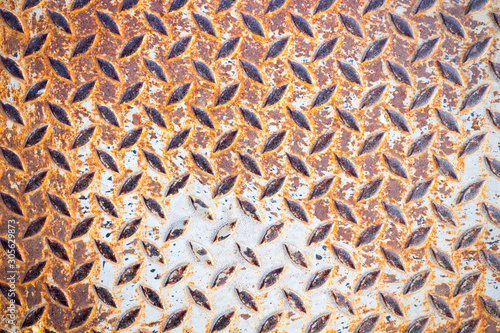 Pattern diagonal gray and rust on metal.