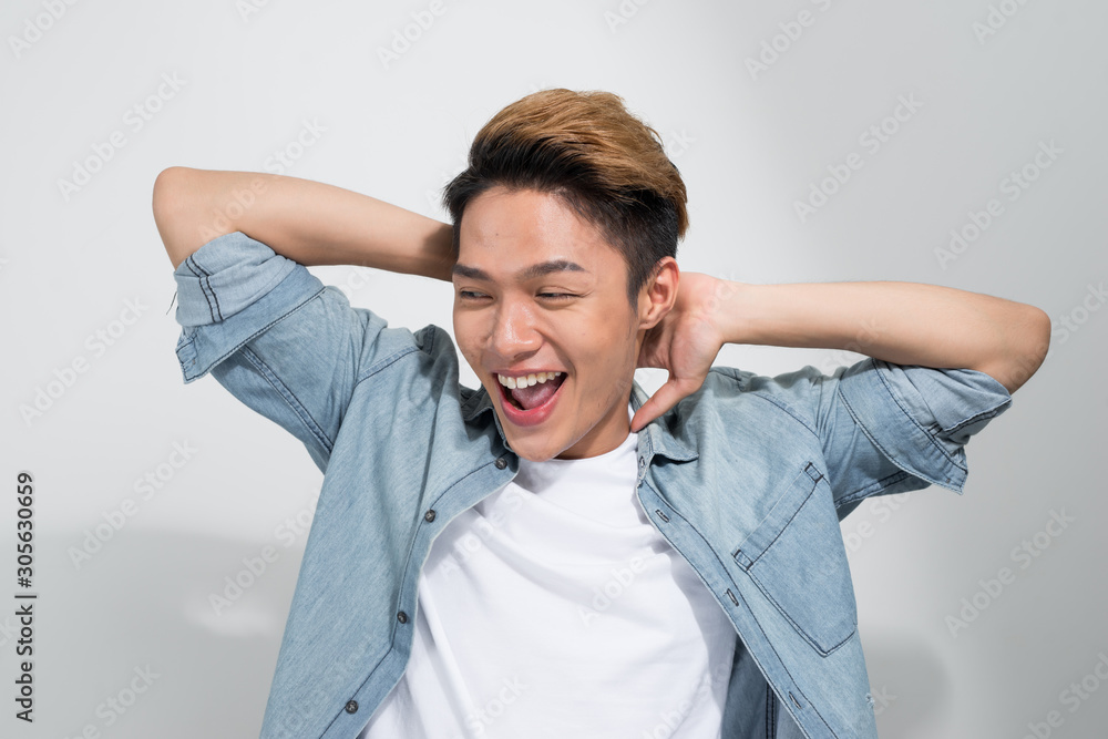 A portrait of happy excited young Asian man isolated on white background A portrait of happy excited young Asian man isolated on white background